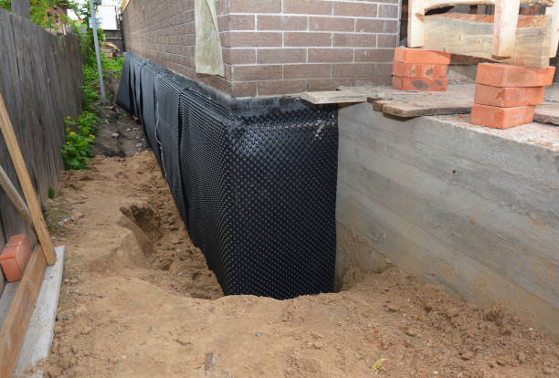 Happy homeowners after waterproofing job in Etna